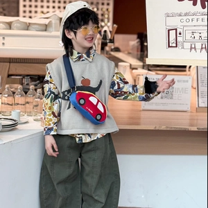 Cute red car-shaped crossbody chest bag for kids with fashionable street style outfit