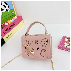 Detailed close-up of pink mini crossbody bag with Capybara pattern and gold chain strap