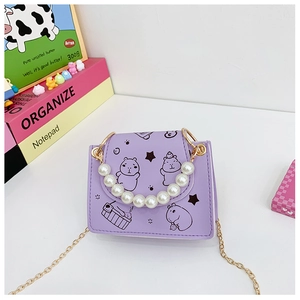 Detail of purple children handbag with pearl handle and cute capybara cartoon print