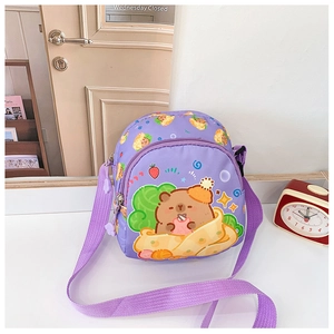 Close-up of light purple kids crossbody bag featuring cute bear print and adjustable strap