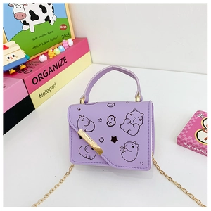 Detail of purple mini crossbody bag with cartoon capybara print and golden chain strap