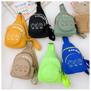 Detailed flat lay of children canvas chest bags in six colors with cartoon prints