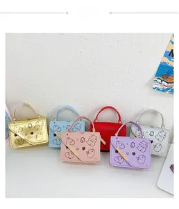 Detailed view of mini cartoon bear shoulder bags in six vibrant colors for children