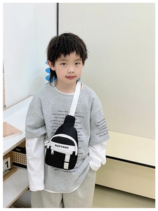 Close-up of black and white contrast kids chest bag with KAVINAI letter print