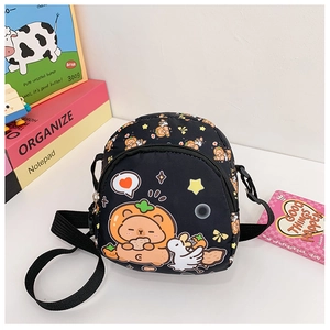 Detail of children's mini crossbody bag with cute bear print and adjustable strap