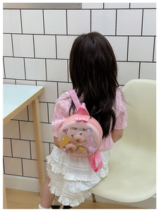 Pink Capybara hard shell toddler backpack shown on child model for outdoor activities