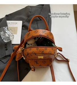 Detailed view of brown printed mini backpack interior showing spacious storage capacity