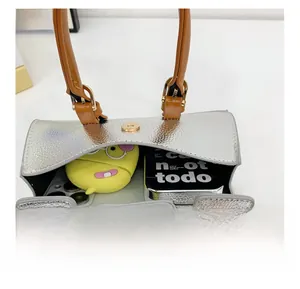 Top view of silver mini tote bag showing internal capacity for phone and accessories