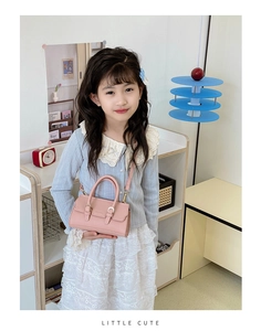 Pink lychee texture mini crossbody bag for kids with silver buckle and top handle