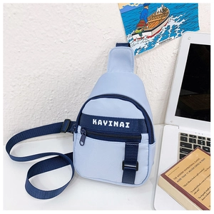 Close-up of light blue kids' chest bag with contrast navy strap and KAYINAI logo