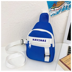 Close-up of royal blue children's chest bag with white zippers and Kayinai logo detail