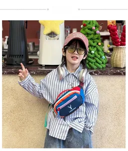 Detail of color-block kids chest bag with deer print and zipper in a cafe setting