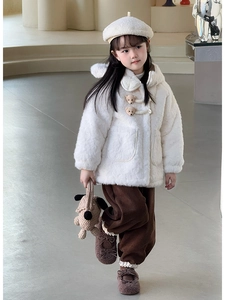 Close-up detail of white fuzzy hoodie with adorable 3D bear buttons and large pockets