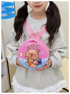 Close-up of pink round hardshell toddler backpack with cute cartoon bear pattern