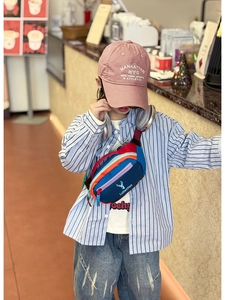 Close-up of colorful patchwork kids chest bag with deer logo and zipper details