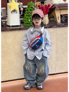 Kid wearing a colorful nylon crossbody chest bag with cute deer icon in a cafe setting