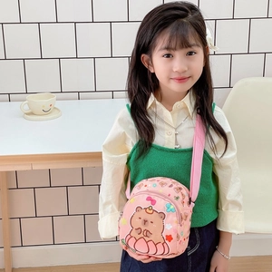 Cute pink kids crossbody bag with cartoon capybara print and adjustable strap
