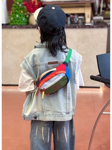 Rear view of a colorful color-block kids chest bag with a red deer logo on a model