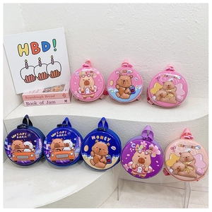 Detail of round hard-shell toddler backpacks featuring colorful Capybara cartoon designs