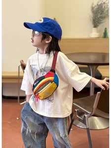 Detailed view of kids' colorful patchwork chest bag with cute deer logo and red strap