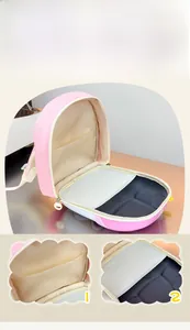 Detail view of pink bunny backpack interior with mesh pocket and multi-compartment storage