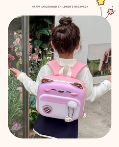 Pink and white cat-themed children's backpack with 3D ears and cute fish charm detail