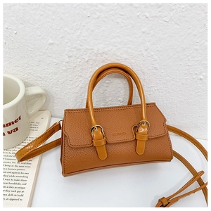 Detailed close-up of brown litchi pattern leather mini handbag with KEYOUKA brand embossing