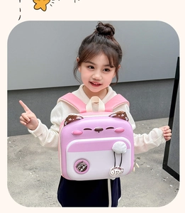 Detail of cute cat-shaped kids backpack with 3D ears and Meow logo on pink white shell