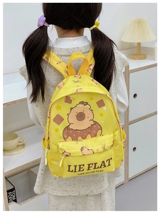 Detail view of yellow Capybara backpack for kids with cute cartoon donut print and pockets