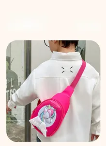 Close-up of pink unicorn chest bag with white sequin wings on a child model back