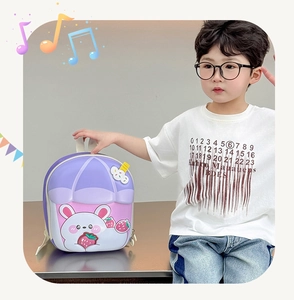 Detail of purple and pink rabbit backpack with 3D ice cream charm on a young boy