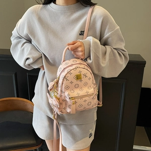 Pink monogram mini backpack for women with textured leather and adjustable straps