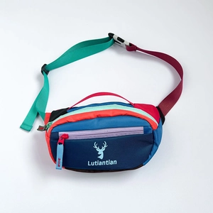 Vibrant multi-colored children's waist bag featuring a cute deer logo and adjustable strap