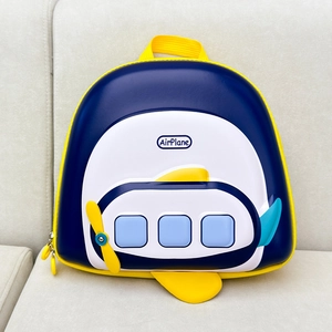 Detail view of the airplane shaped kids backpack with durable EVA hard shell and yellow zippers