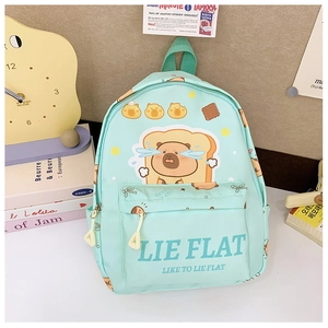Detail of mint green capybara backpack with cartoon print and front zipper pocket