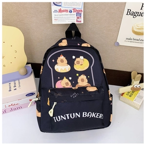 Close-up of black kids backpack featuring cartoon capybara prints and Tuntun Bakery text