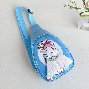 Detail of blue child's chest bag with a cartoon unicorn and white sequin wings