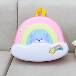 Detail of cute rainbow cloud backpack for kids featuring a bear and yellow star decor