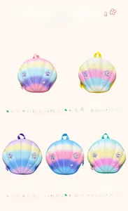 Detail of colorful shell-shaped backpacks for kids with pearlescent finish and stars