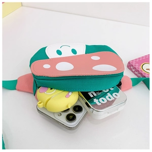 Detail view of cartoon mushroom waist bag showing interior storage for phone and accessories
