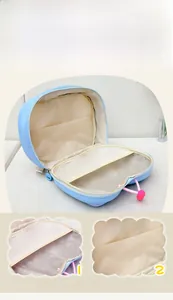 Detail of light blue butterfly backpack interior showing organized mesh compartments