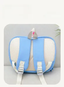 Detail view of breathable honeycomb mesh back and wide straps on children backpack