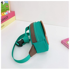 Side view of kid's green canvas waist bag showing zipper detail and adjustable strap