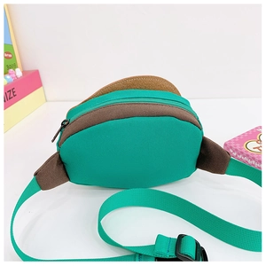Detail of teal mushroom waist bag showing adjustable canvas strap and durable plastic buckle