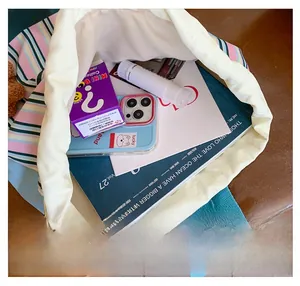 Internal view of striped school backpack showing large capacity for books and stationery