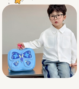 Close-up of sky blue 3D butterfly toddler backpack with pink handle and star patterns
