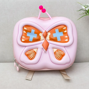 Detailed view of kids butterfly backpack with 3D wings and durable pink hardshell material