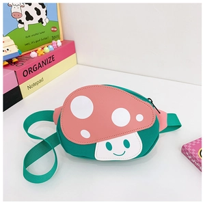 Close-up of cute mushroom-shaped waist bag for kids with green body and pink dotted cap
