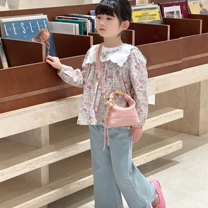 Minimalist pink leather crossbody bag for girls paired with a vintage floral shirt outfit