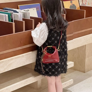 Red glossy leather mini hobo bag for girls with strap and black-white stripe charm